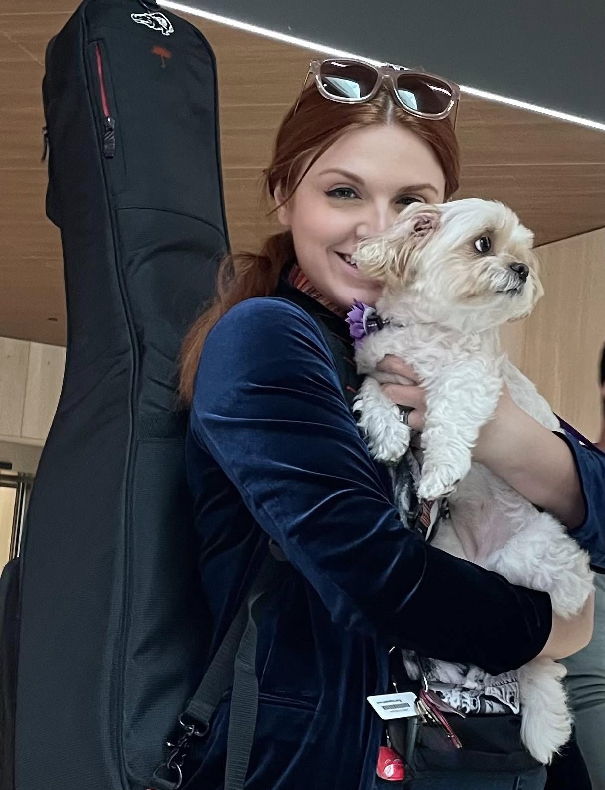 Passenger holding Nashville Therapy Pet at Nashville International Airport